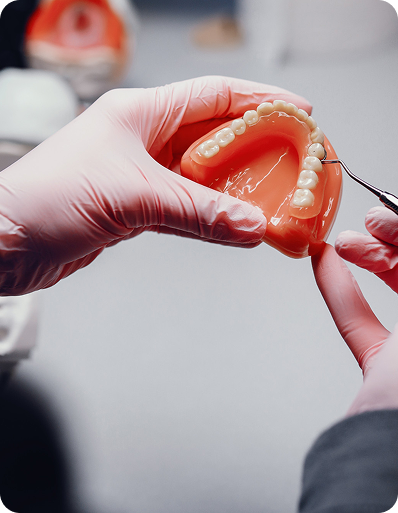 Partial denture being adjusted